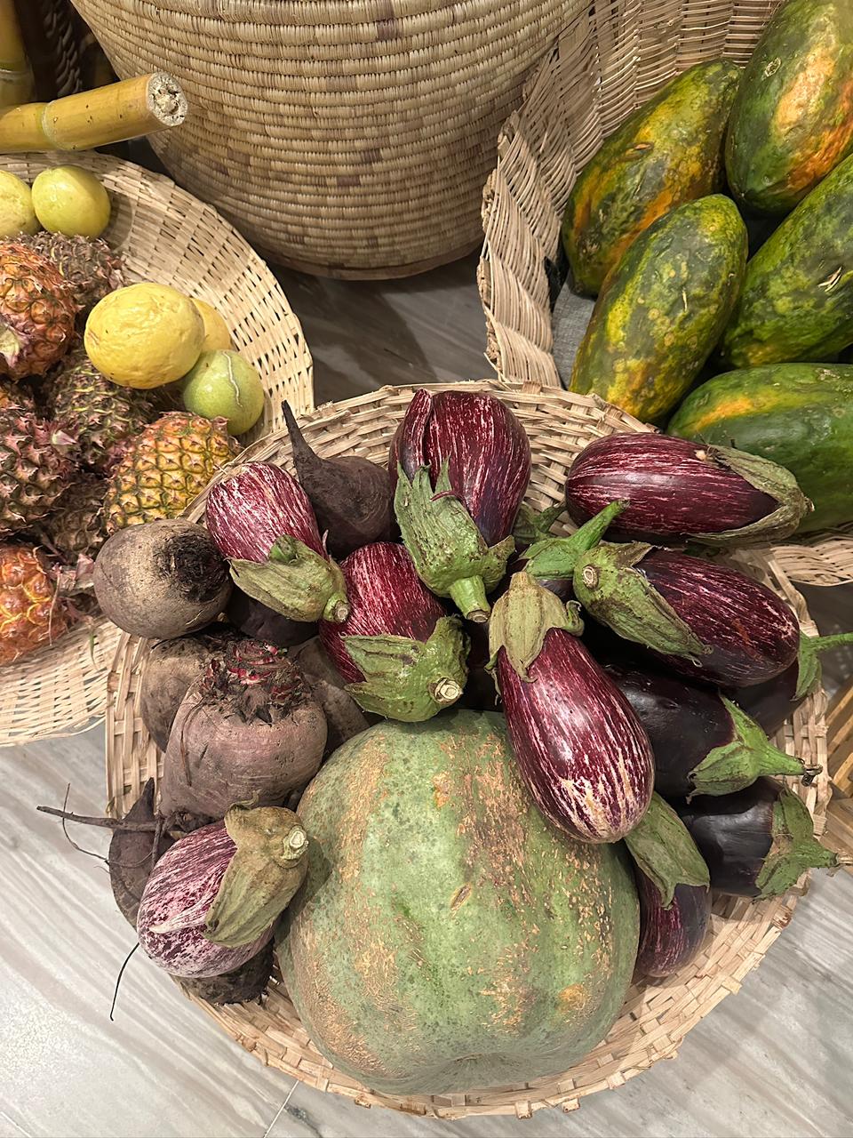 Basket of heirloom aubergines, beetroot, pineapples and seasonal produce sourced for the KOMÉ kitchen