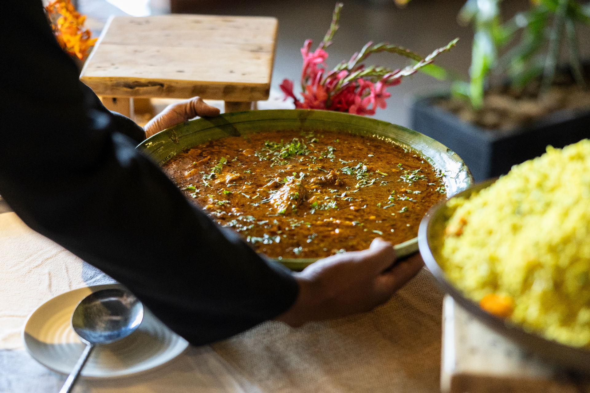 Slow-cooked lamb curry served family style